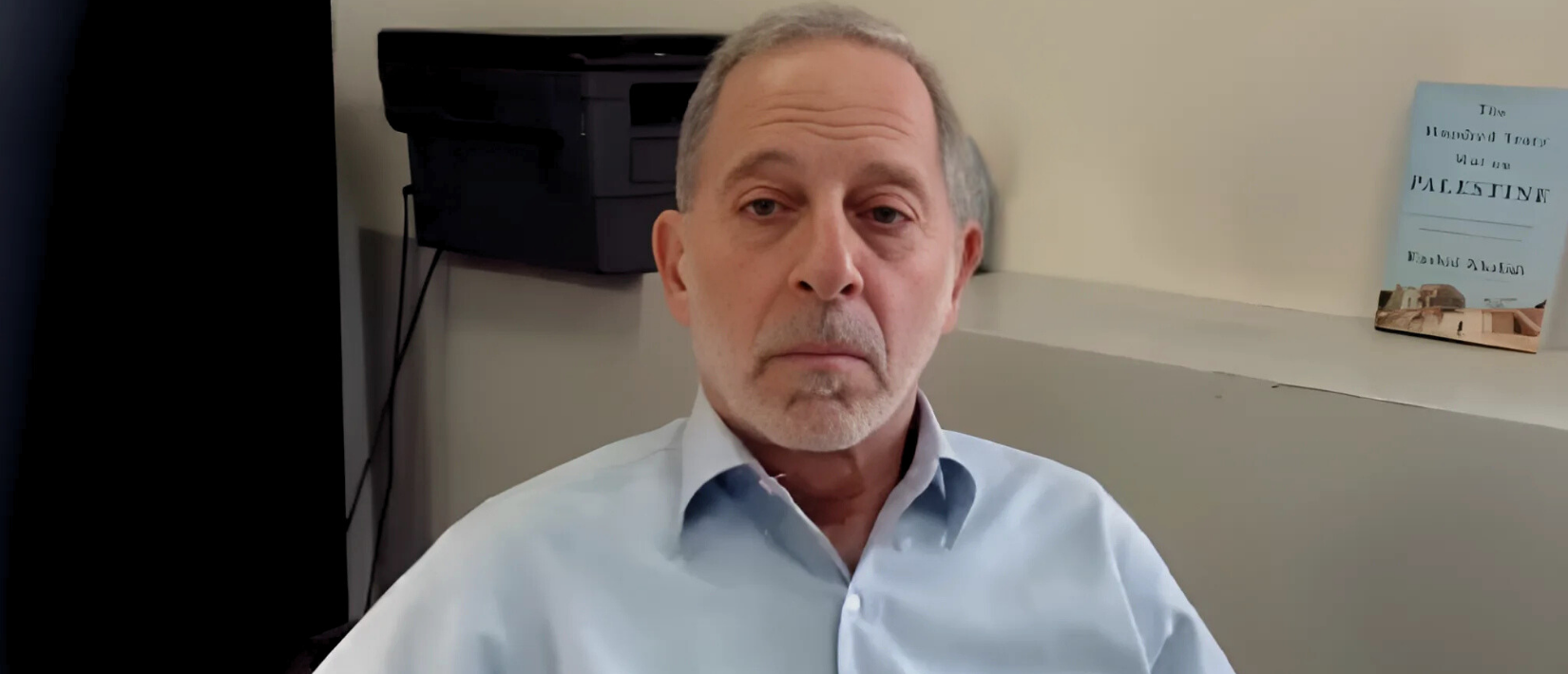 Rashid Khalidi sitting at his desk through a Zoom screen