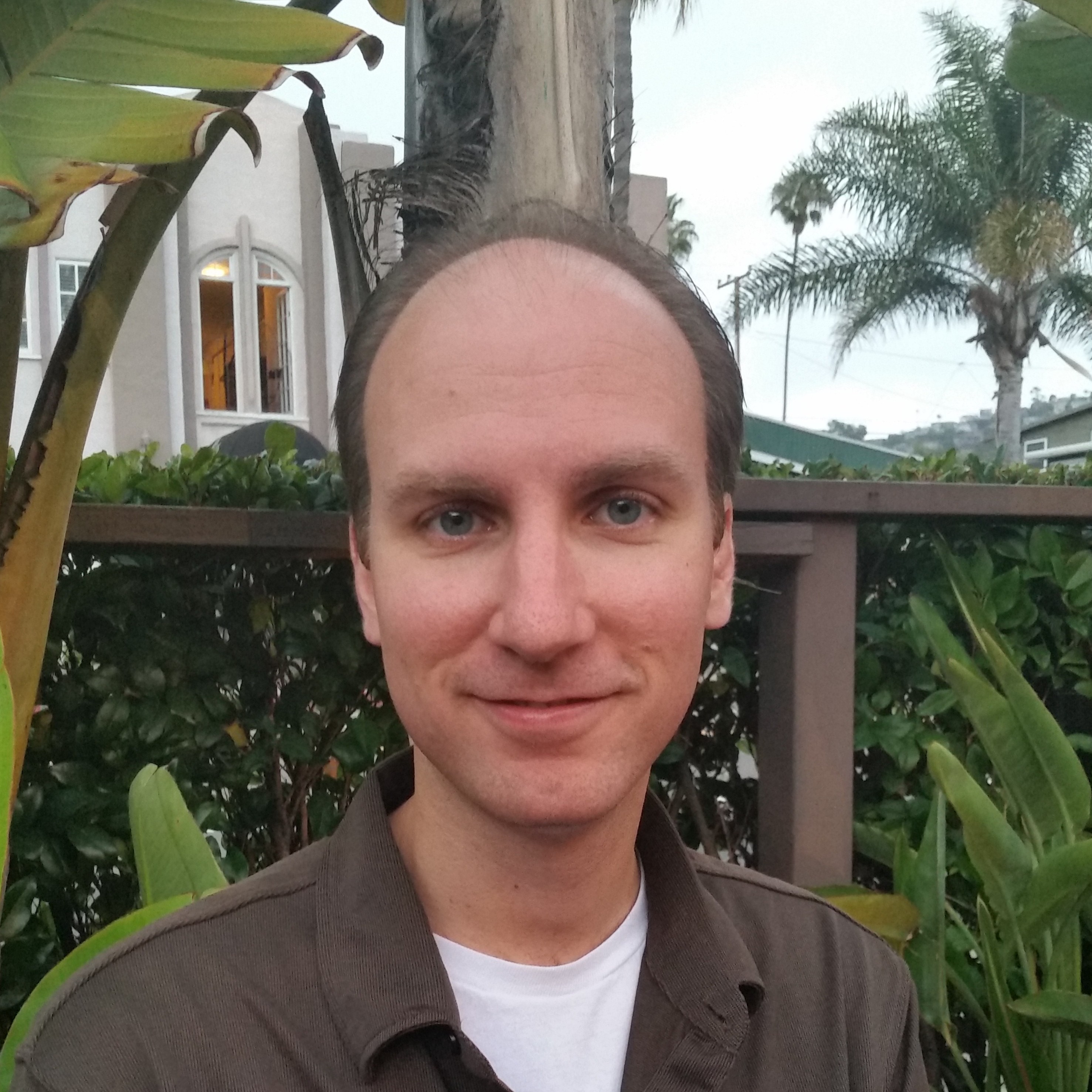 Headshot of a man smiling