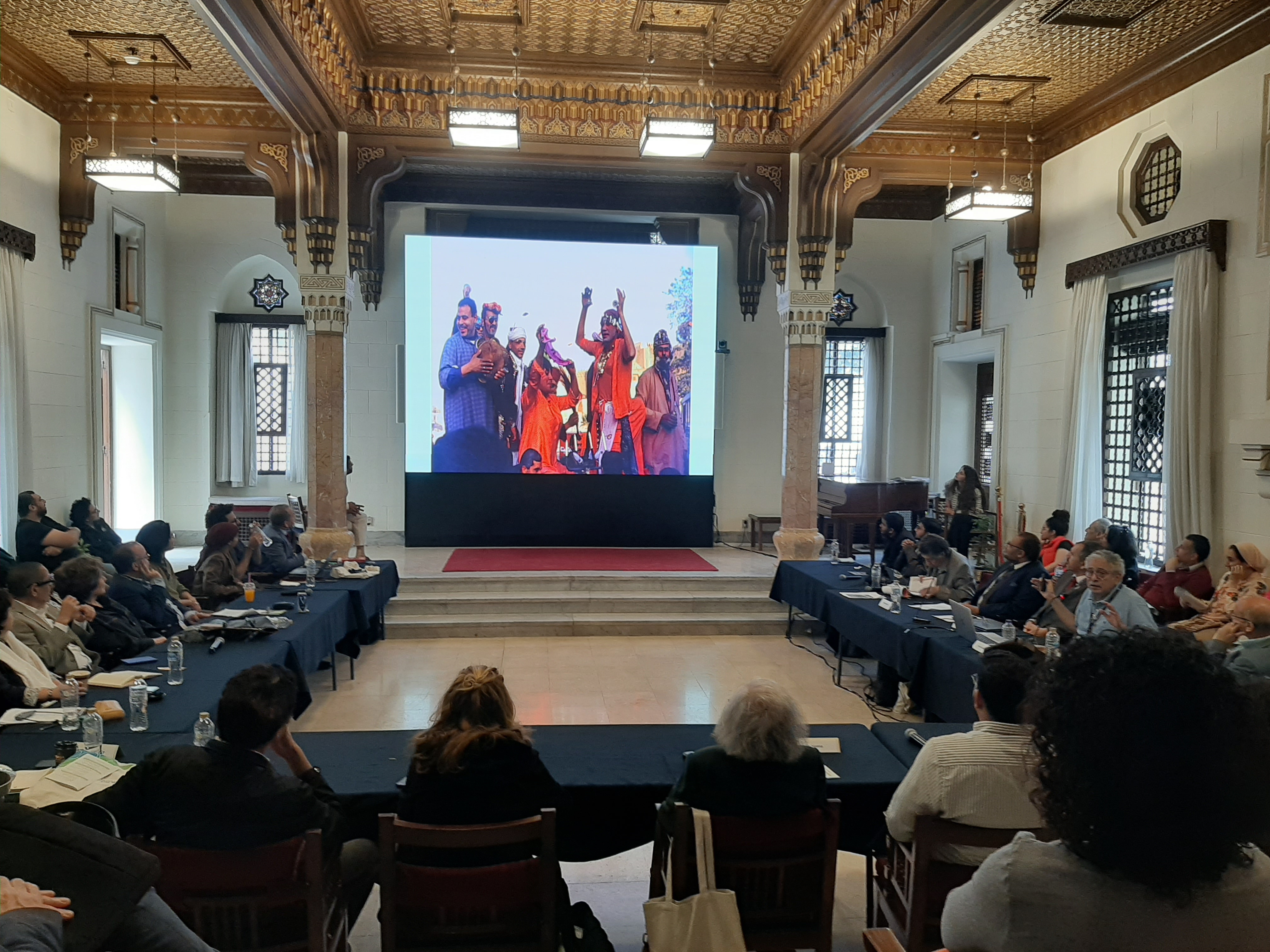 an image capturing the audience and the speaker in the event's venue
