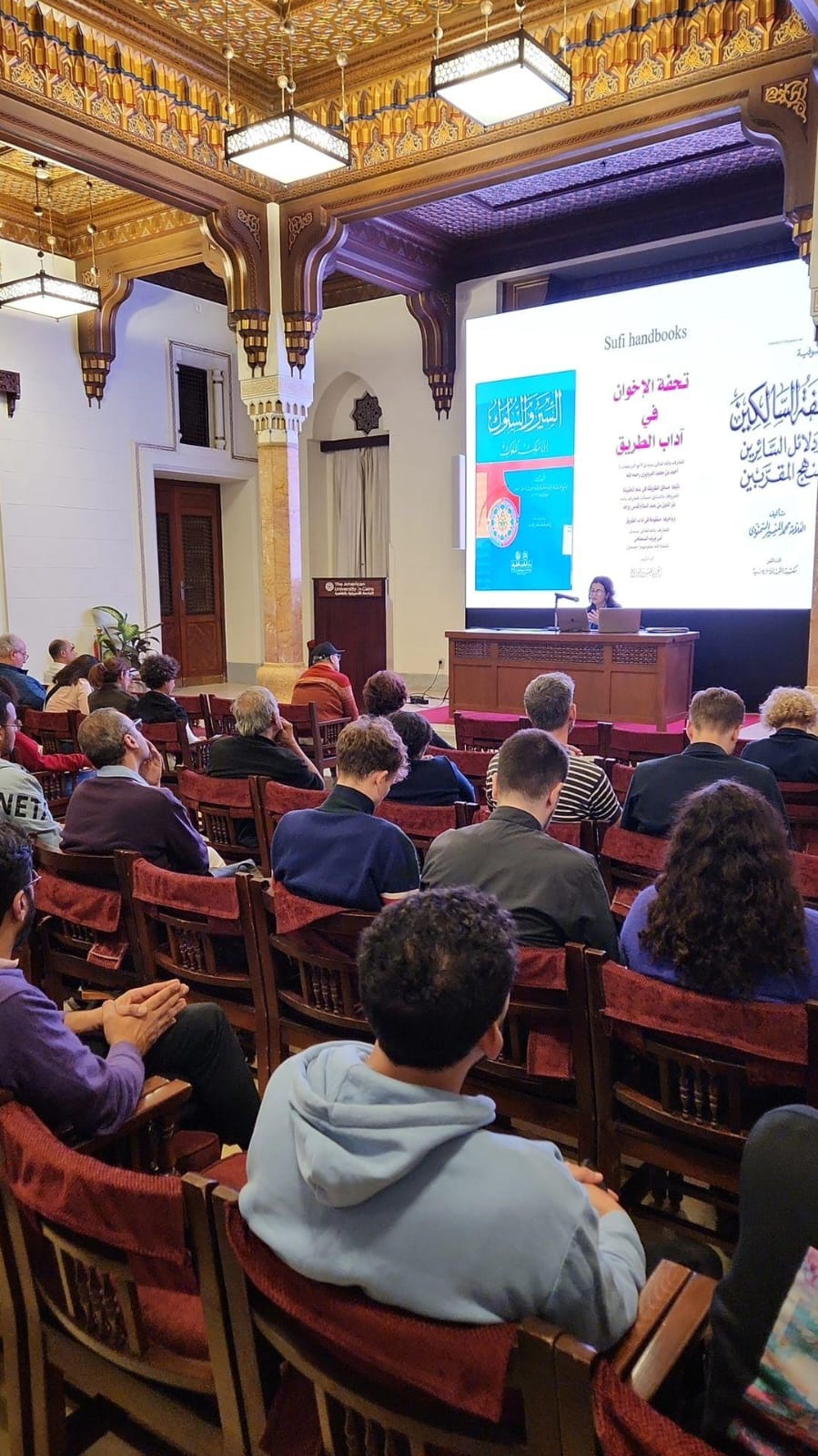 bayard dodge event photo showing the audience and speaker