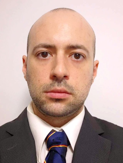 Headshot of a man in a suit