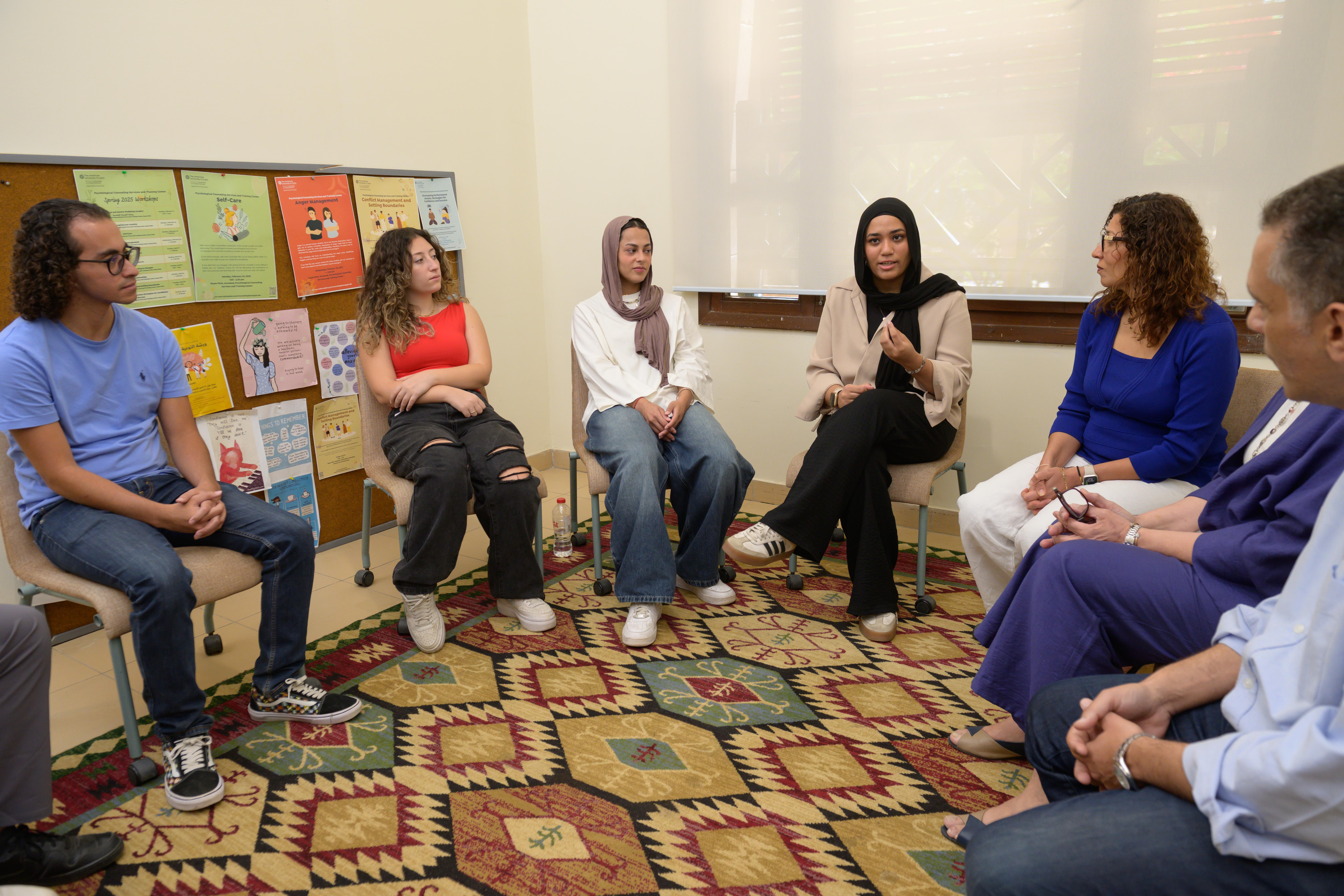 A group of people engaging in a conversation 