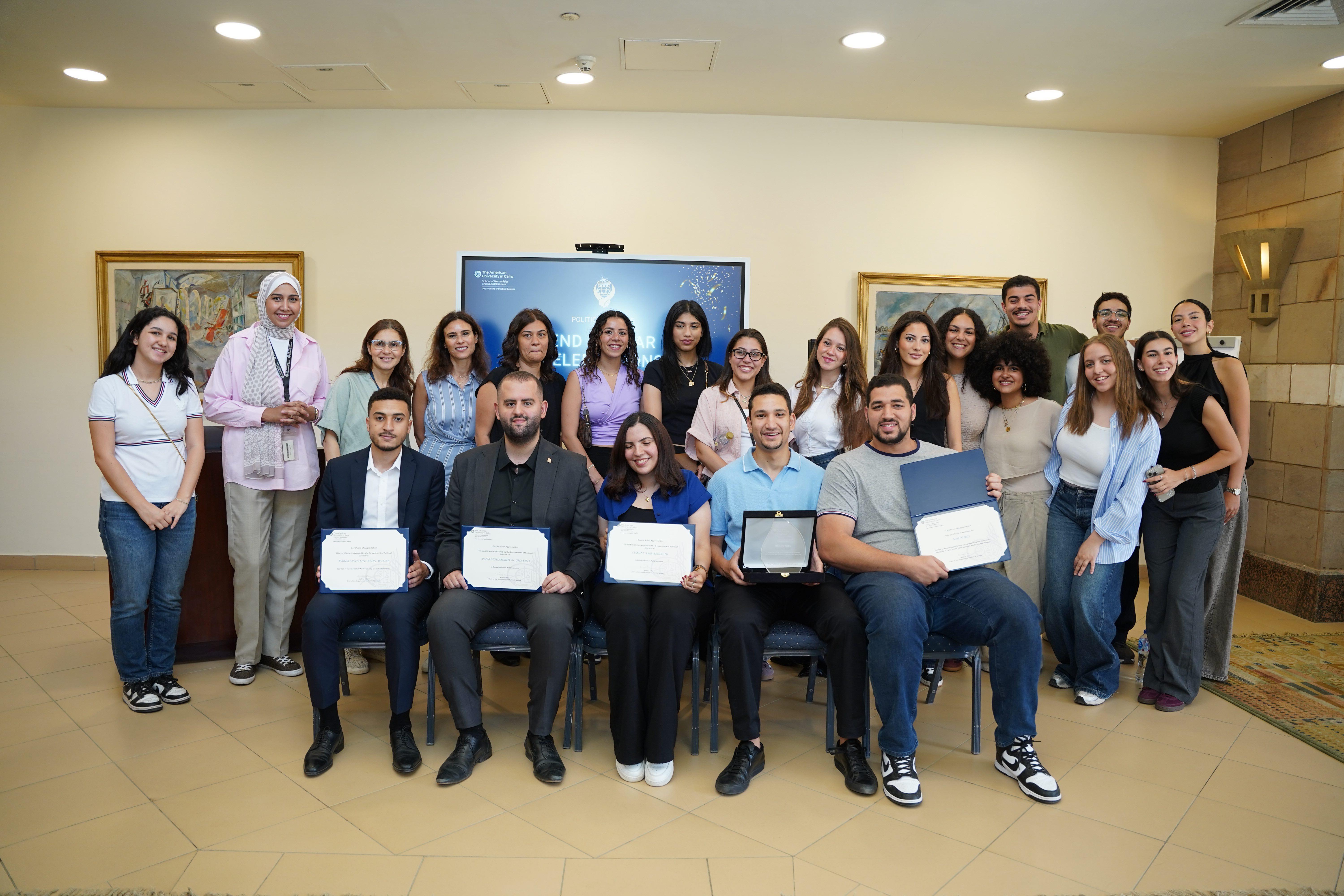 political science students getting certificates for their achievements 