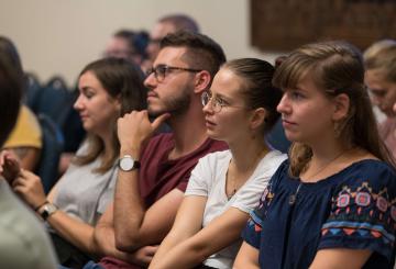 group of students listening to a lecture