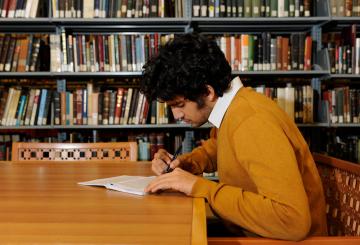 student studying in the library