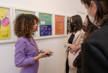 A girl talking to a group of people