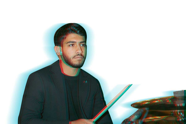David Maged plays the drums