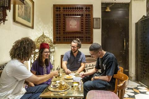 students embracing Egyptian cultural in restaurant