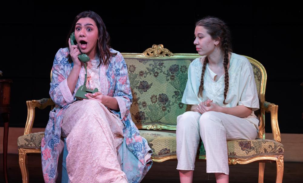 students performing on stage 