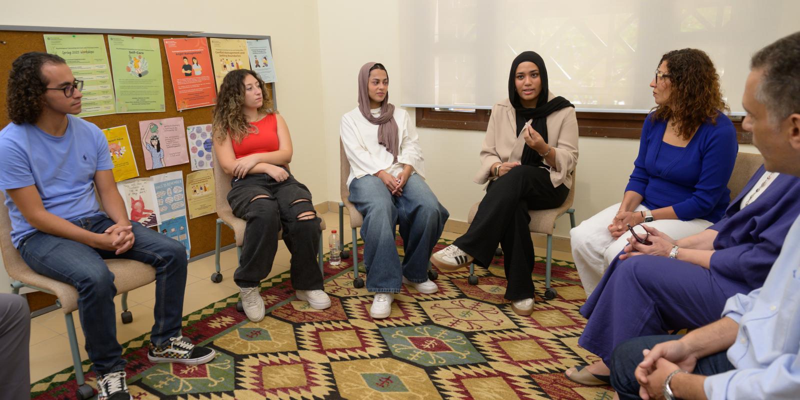 A group of people engaging in a conversation 