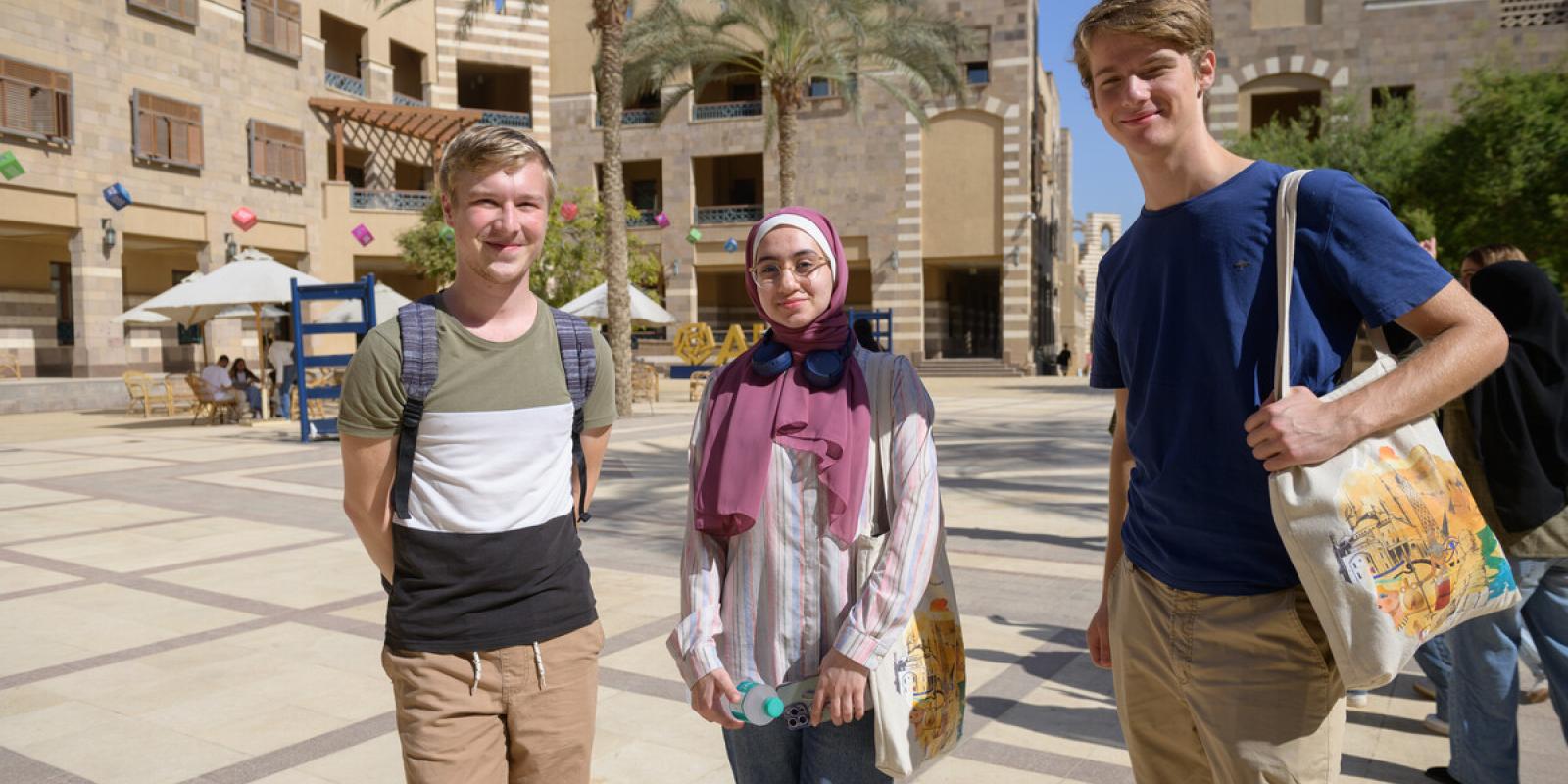 international students walking on campus going to class
