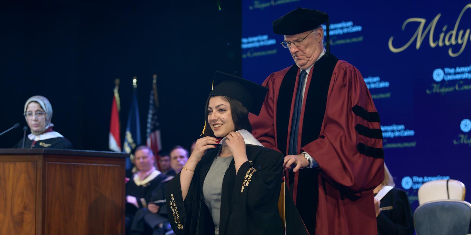 Dean Meloy and a graduating student