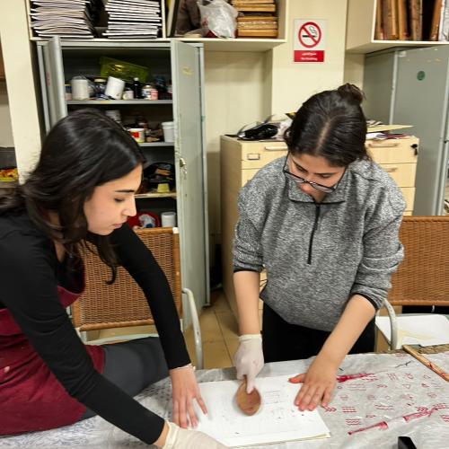 girls working with rubber stamp