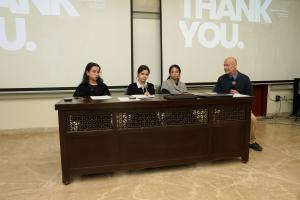 image from the history day showing Dr. Mehcael Riemer and students