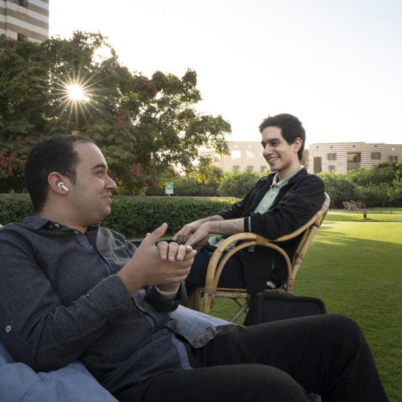 students sitting and talking the AUC garden